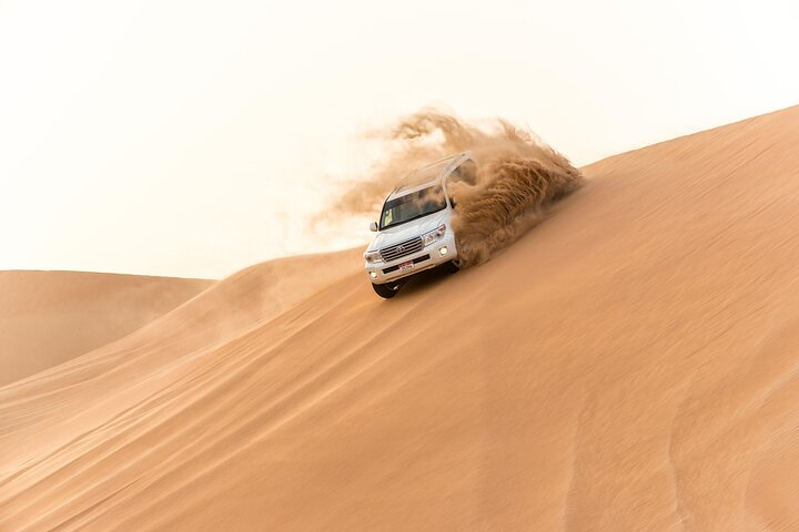 Experience the rush of dune bashing in a 4x4 carving through the endless sands of Dubai’s desert for an unforgettable adventure. Feel the power and freedom of the wild landscape!